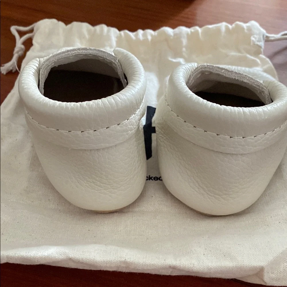 Freshly Picked White Baby Moccasins with Crown Accent